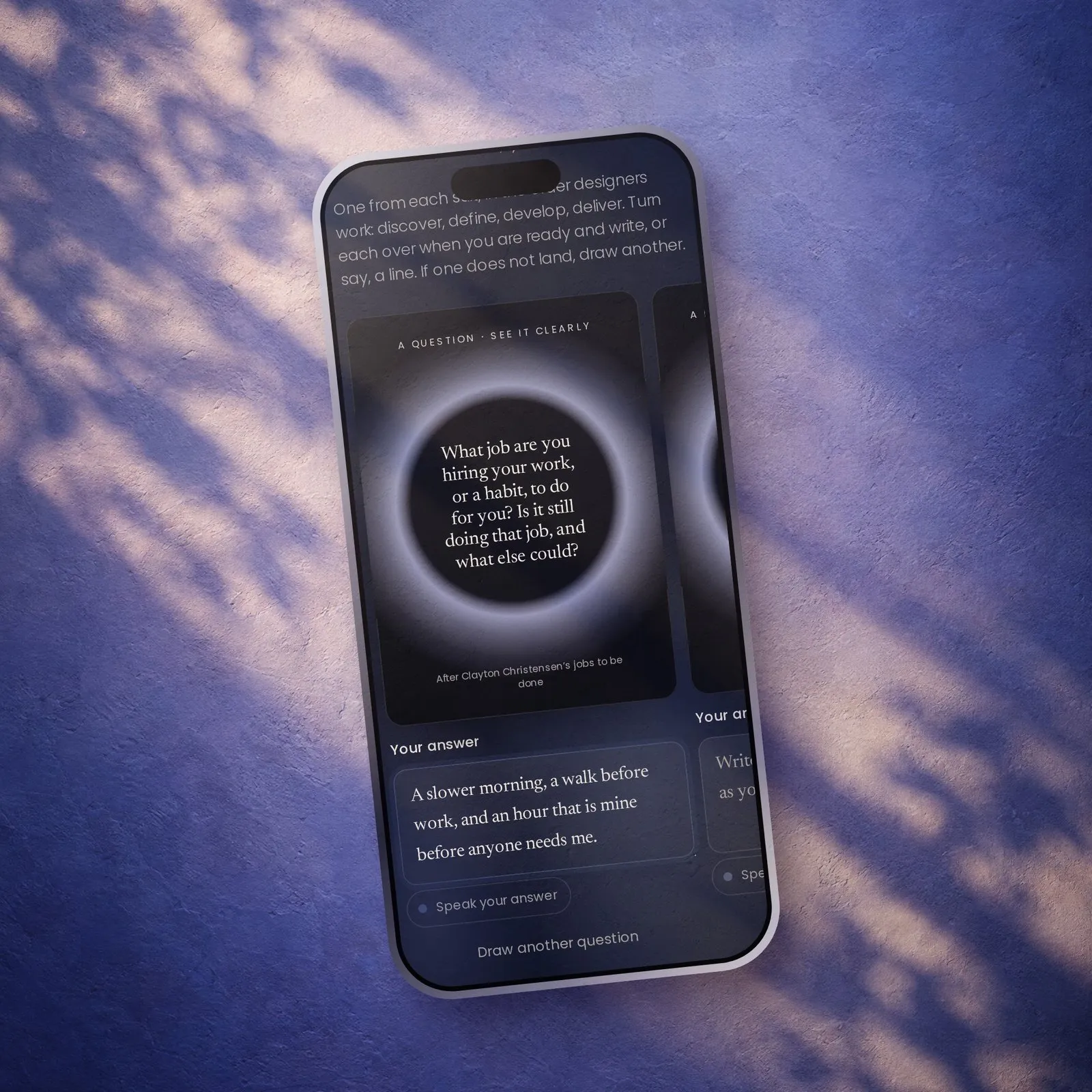 Design Your Next Chapter on a phone: a question card turned over, with an answer written beneath it.